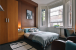 Spacious and modern studio room with window at Francis Gardner apartments in London