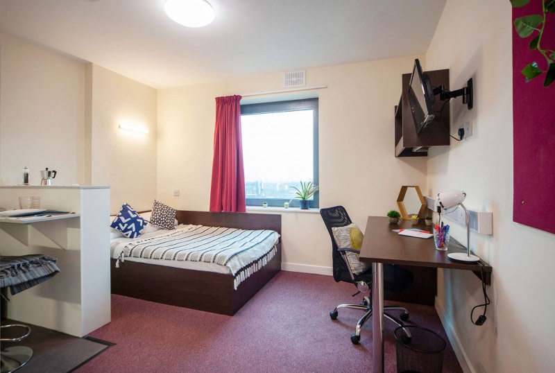 St George's Tower premium studio: bed, kitchenette, study area.