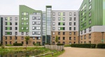 Modern student accommodation building at The Green, Bradford, featuring large windows and a welcomin