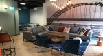 Comfortable and modern social share space with sofas table at Barker House in Newcastle