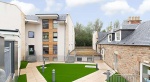 Modern student accommodation at Goods Corner Edinburgh with a landscaped green courtyard