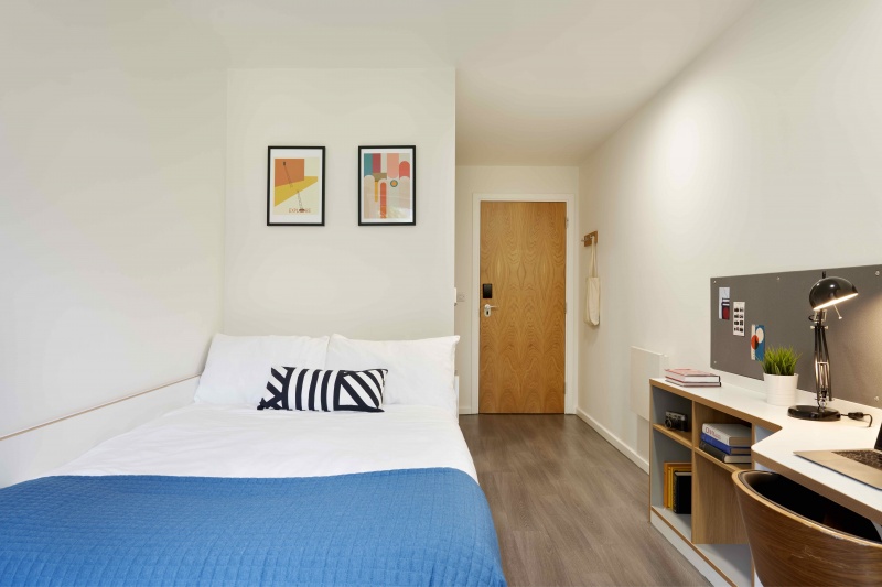 ASA Briggs House bedroom en suite with a study desk, bed