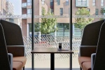 Bright Common Area with seats and table at Sharman Court