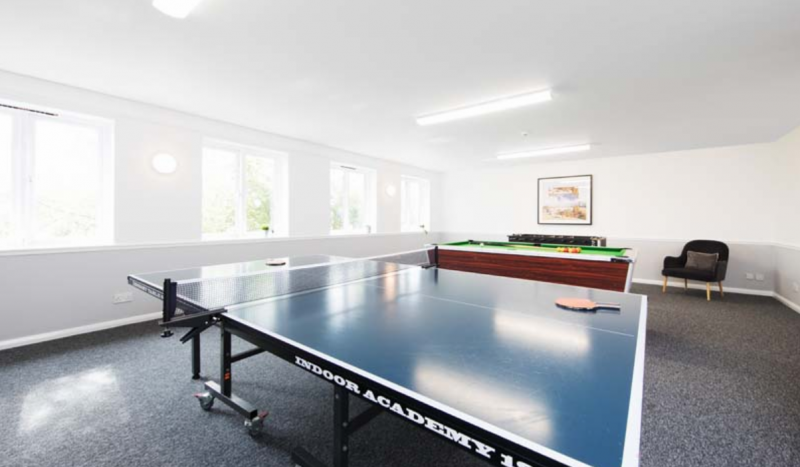 Games room with ping pong and pool tables in Calthorpe Court, Birmingham