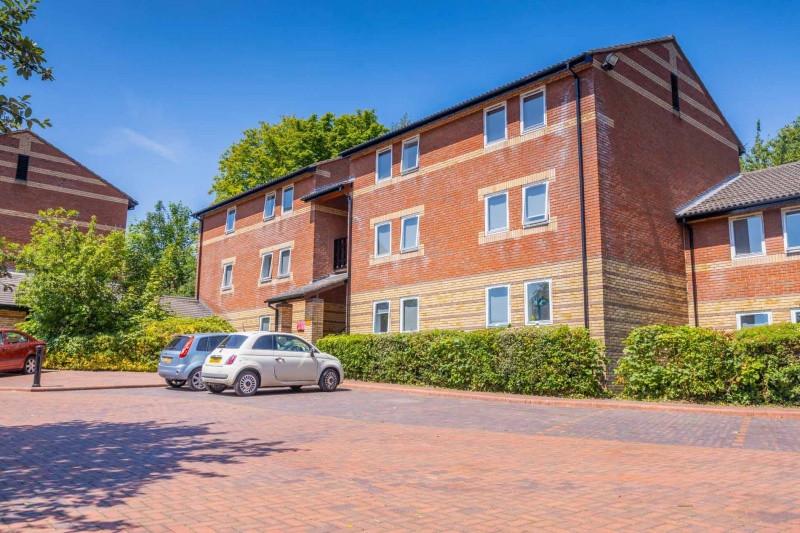 Exterior view of Beech Gardens, showcasing the modern student accommodation buildings with a parking