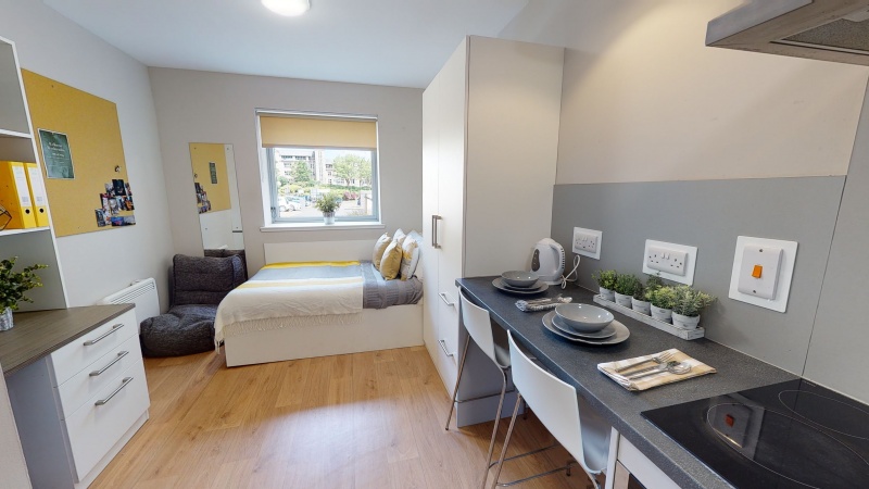 Modern bedroom with ample storage space at Centro House student accommodation in Stirling