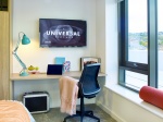 Bright bedroom with a study desk and window at Nurtur House, Sheffield