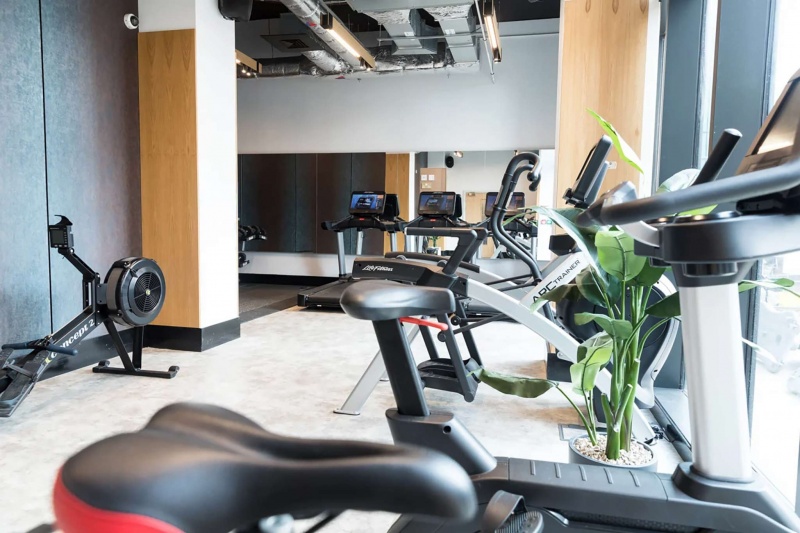 Fully equipped gym at Seren student accommodation in Swansea, featuring modern fitness equipment