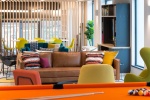 Comfortable and colorful social space at The Neighborhood Exeter