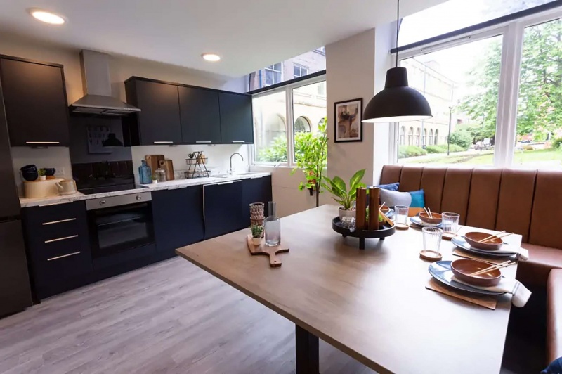 View of the a shared kitchen and living area at The Leather Works in Leeds