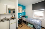 Modern bedroom with desk and chair in Crosstrend House student accommodation