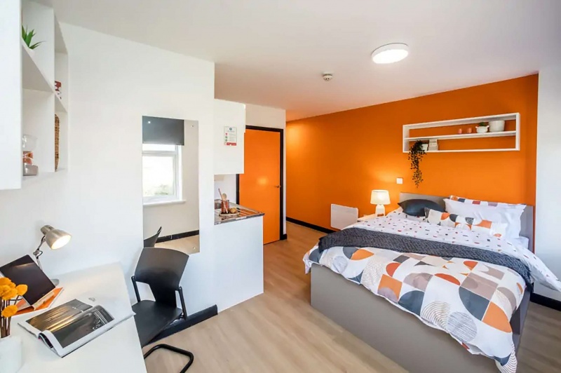 Modern bedroom with desk and chair in Crosstrend House student accommodation