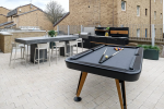 Huxley Studios Outdoor Courtyard BBQ and Games Area