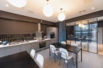 Modern communal kitchen at Onyx Birmingham with dining tables