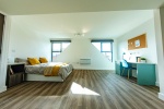 Comfortable studio with bed and desk, kitchenette and storage at The Nest in Nottingham