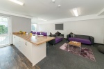 Communal living area with seating and TV at the student accommodation Quayside Court Almero Newcastl