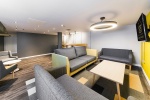 Communal living area with seating and TV, Quayside Court in Newcastle