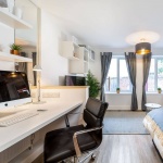 Study desk in a bright studio at Blockyard Apartments in Exeter