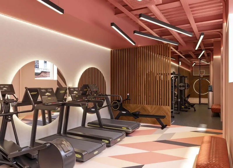 Gym at Fusion Liverpool featuring exercise machines and a basketball hoop.