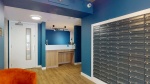 Reception Area: Reception with counter, decorative elements, and mailboxes.