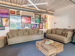 A cozy communal area with comfortable seating and vibrant decor for students to relax or study toget