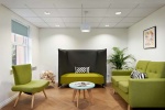 Relaxing common area at Snow Island student accommodation Huddersfield with green seating