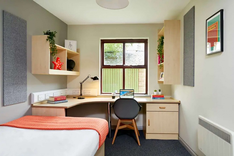 Modern study area in Snow Island accommodation Huddersfield with a desk, chair, storage