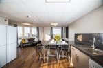 hared kitchen and dining area with city views at The Junxion.