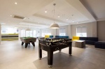 Spacious lounge area with table pool and sofas