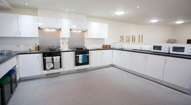 Spacious white kitchen at Powis Place, Aberdeen with modern appliances and ample counter space.