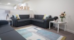 Comfortable lounge at Powis Place, Aberdeen with grey sofas and stylish decor