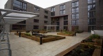 Courtyard view of Powis Place, Aberdeen showcasing outdoor seating and bike racks