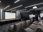 Cinema room with comfortable seating and large screen at Riverside Quay