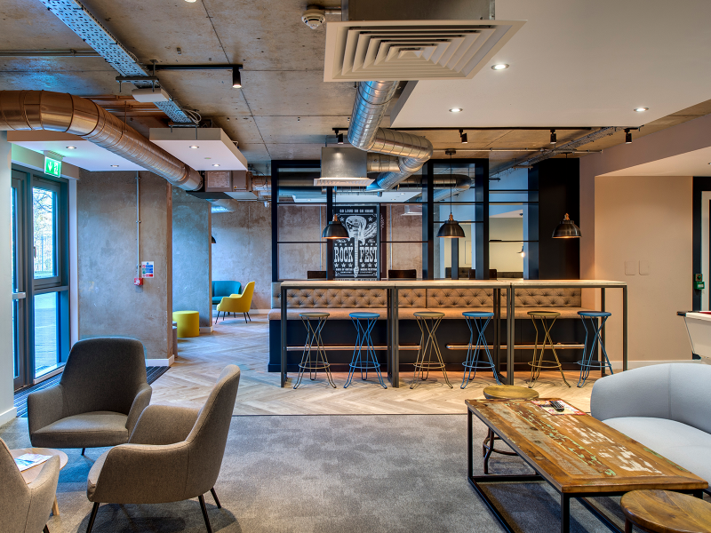 Spacious lounge with comfortable seating at Riverside Quay