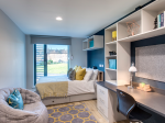 Private en-suite room with bed, desk, and storage at Riverside Quay